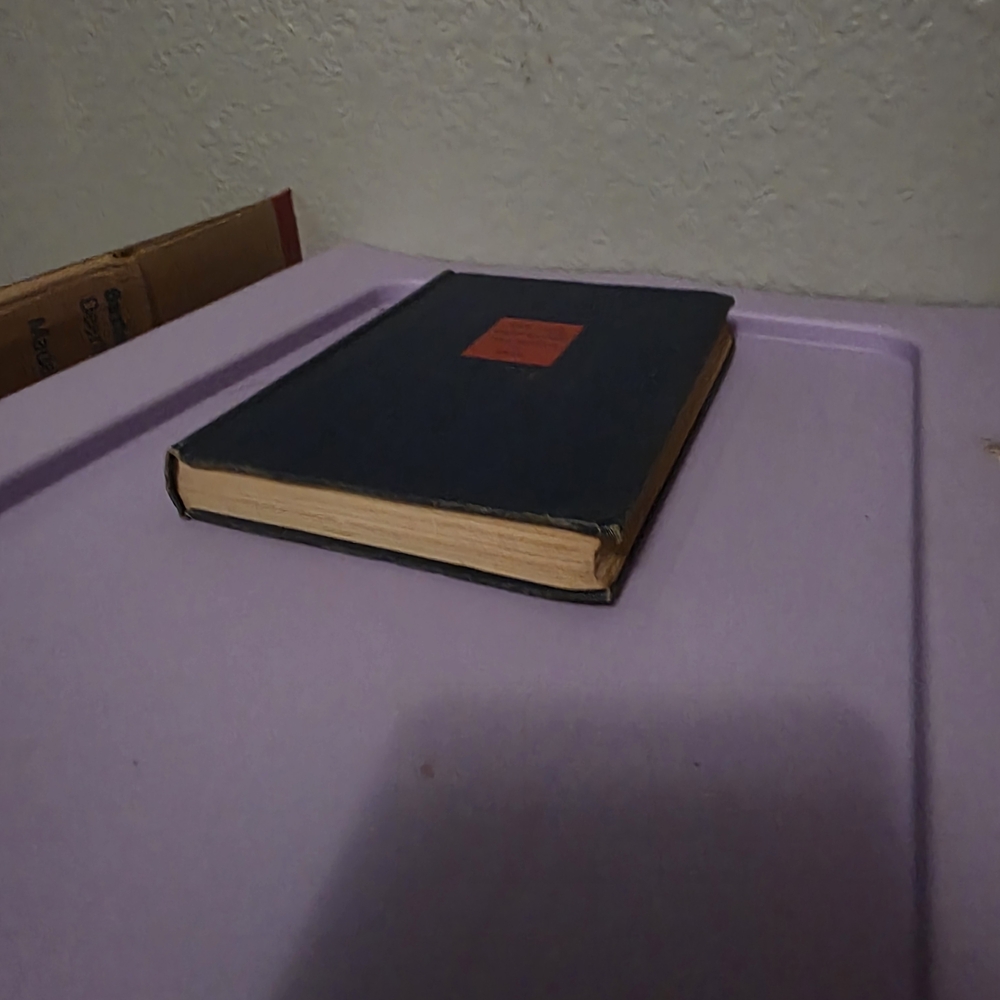 Vintage Hardcover Book with Red Label